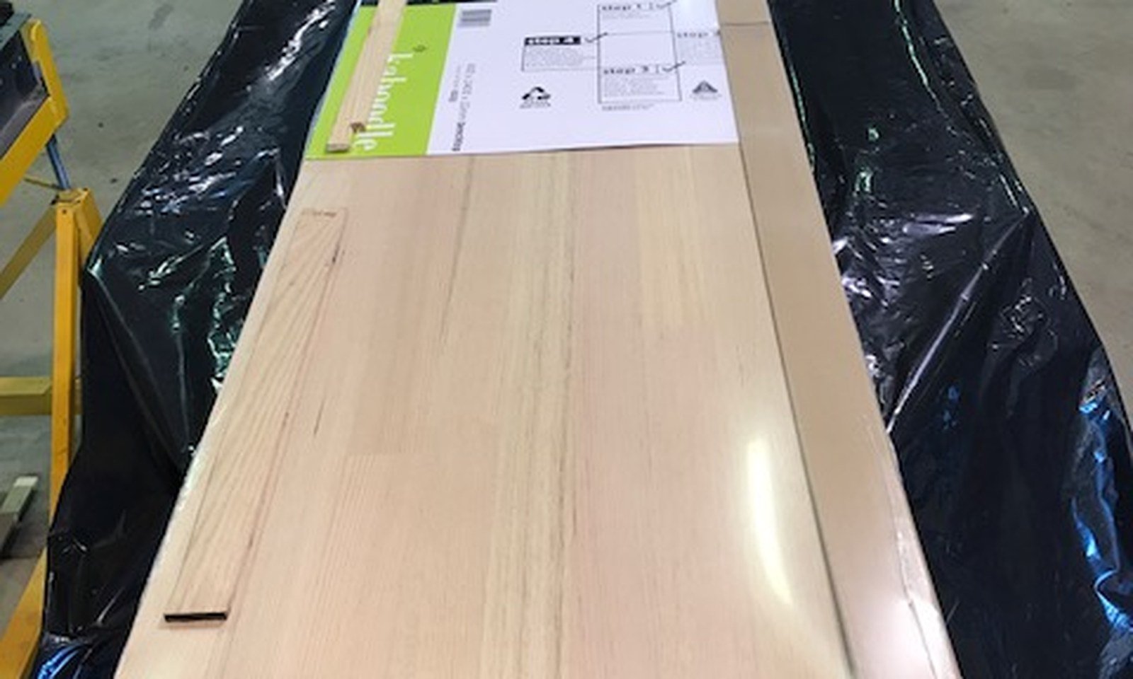 Long glass panel protected with paper edge guards